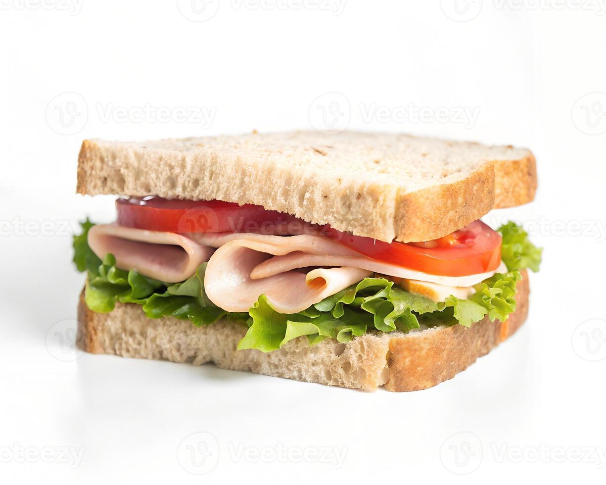 Deliciously crafted turkey sandwich with fresh lettuce, ripe tomato slices, and cheese on whole wheat bread photo