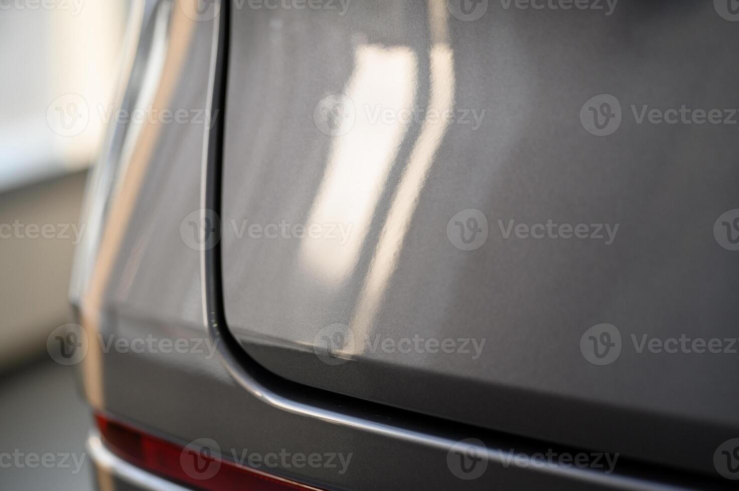 Close up view of the rear part of the modern grey car photo