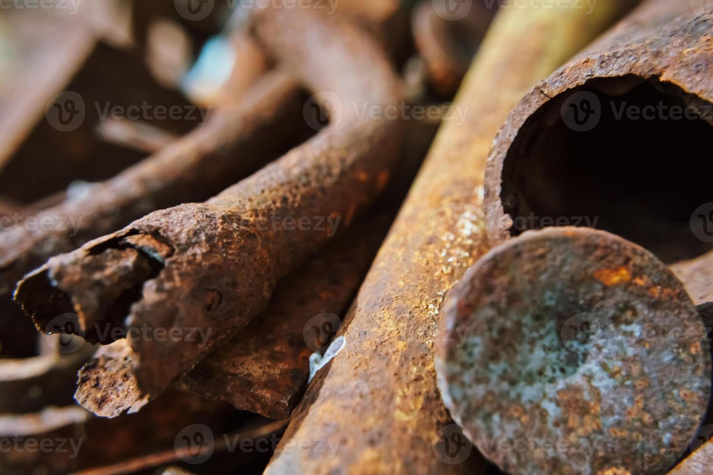 Metal rods. Diverse old rusty scrap metal from different items close-up. Collection and delivery of scrap metal. Abstract Background. Soft focus, defocus photo