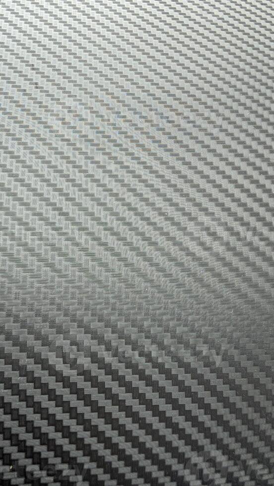A sleek carbon fiber surface texture background that is highly modern and visually striking photo