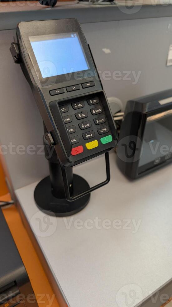 Payment Terminal located at a Checkout Station designed for seamless transactions and commerce photo