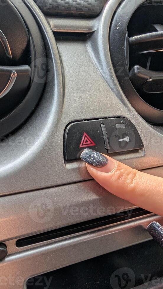 A CloseUp View of the Hazard Warning Button on a Car Dashboard, Highlighting Its Importance photo