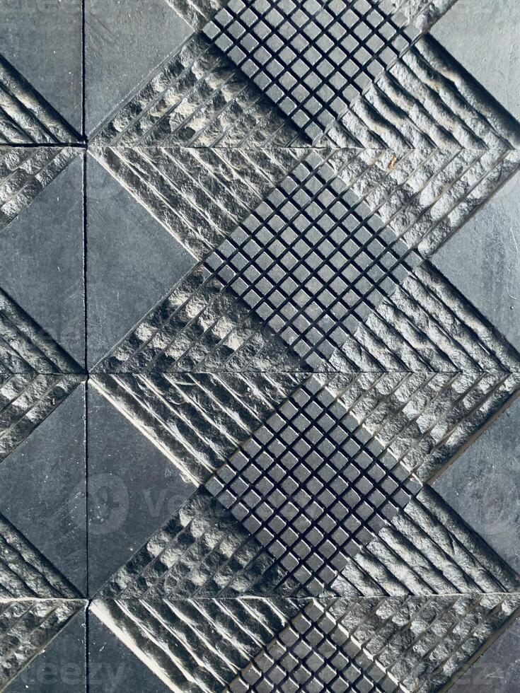 Black Ceramic Tile with Geometric Texture photo