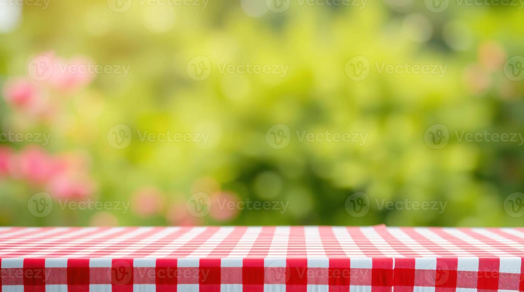 Tablecloth with red and white checkered tablecloth on a green background photo