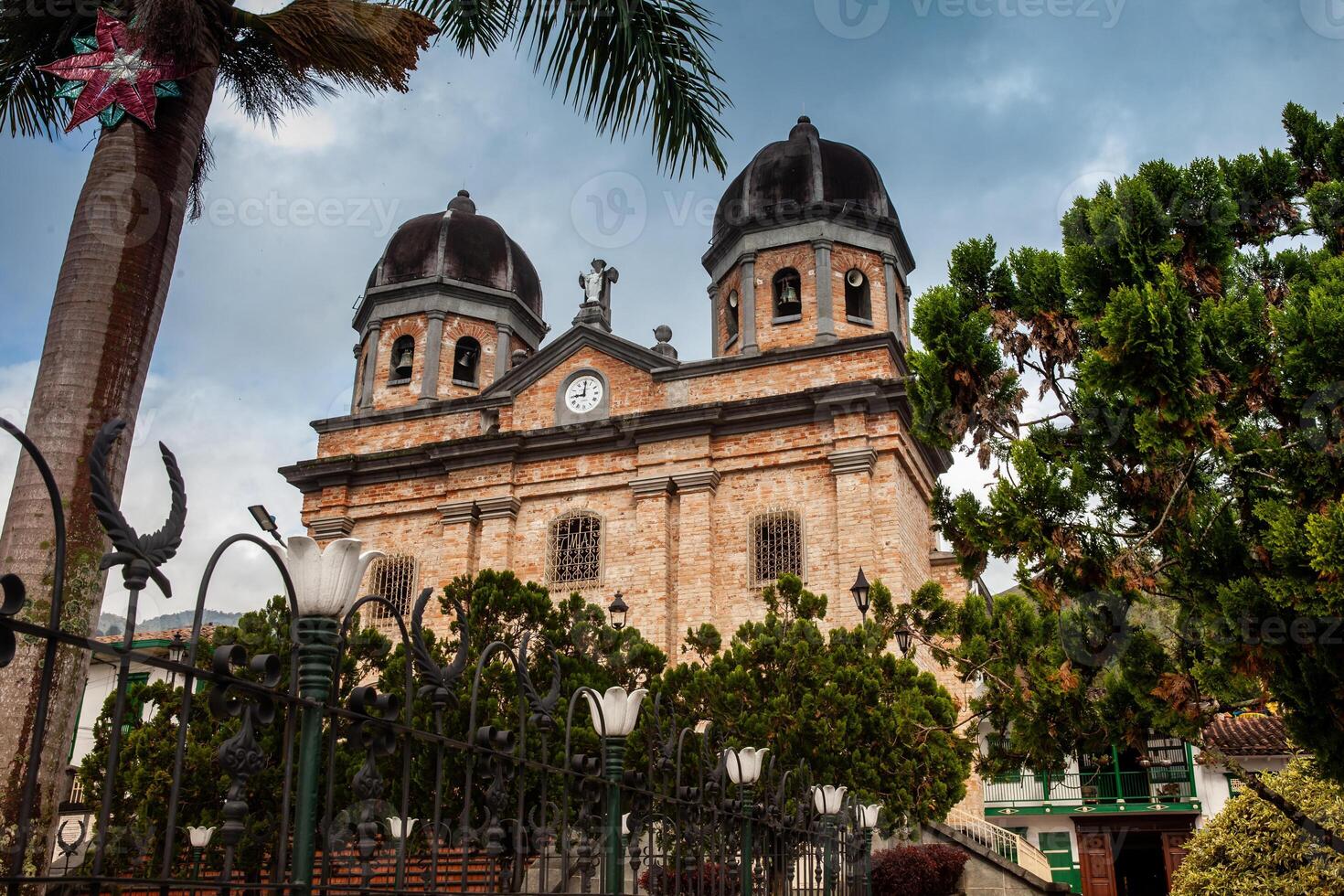 Our Lady of the Immaculate Conception Church and the Jose Maria Cordova Park in the beautiful colonial town of Concepcion in Antioquia, Colombia. photo