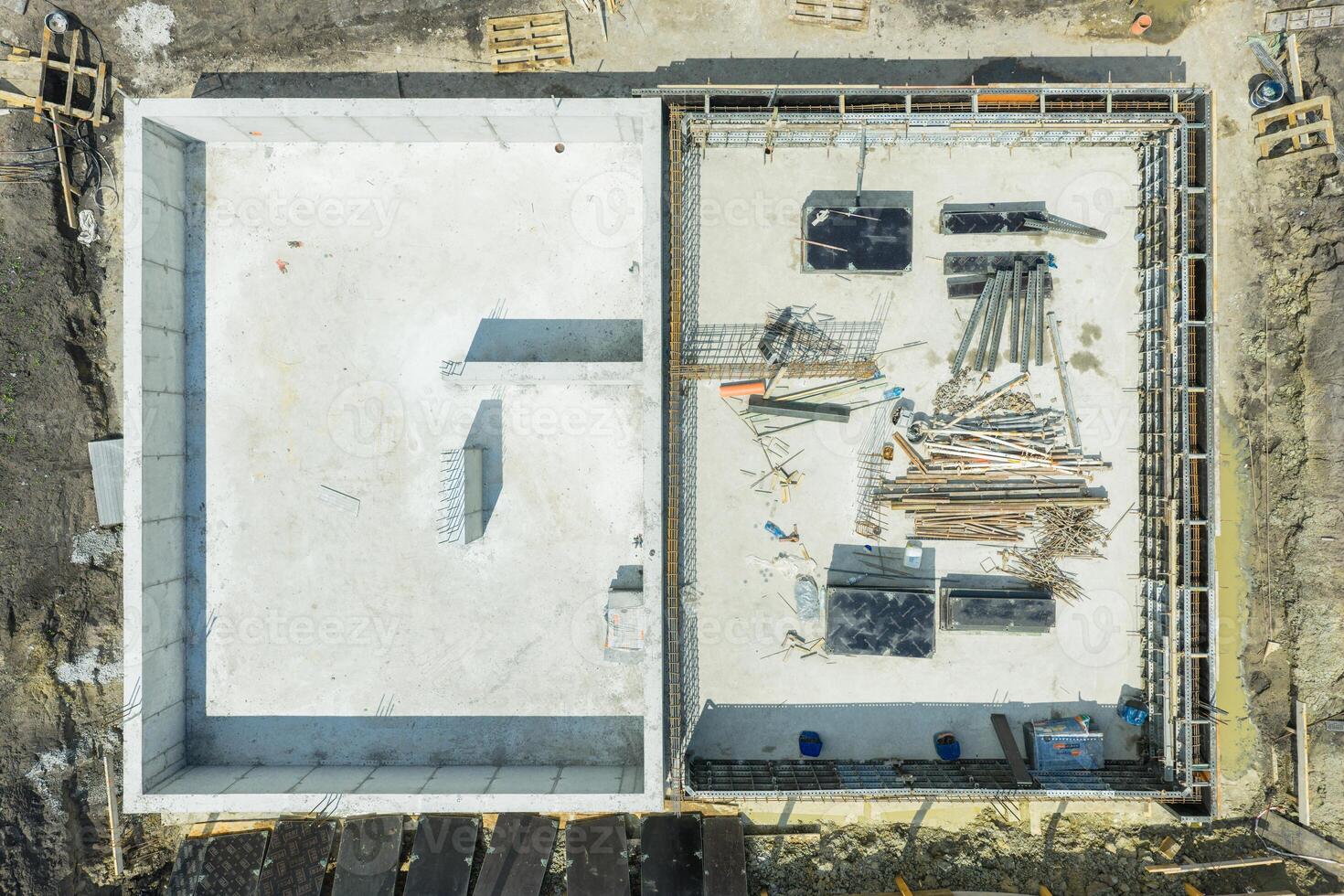 Construction Site Showing Foundation Work and Materials at a Building Project Location photo