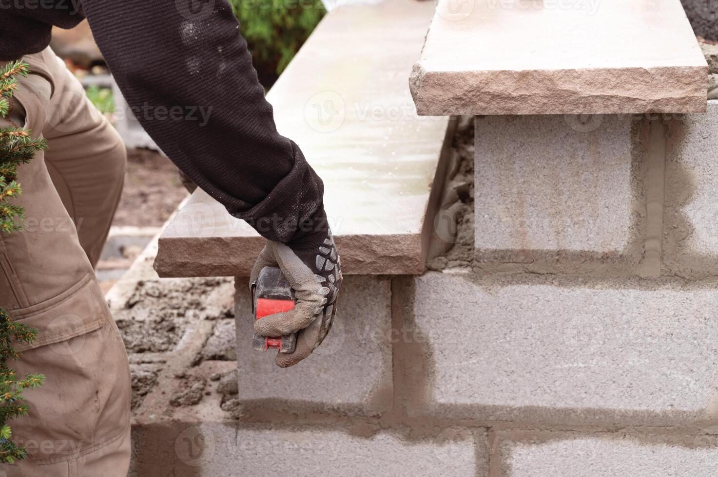 Man measuring stone step photo