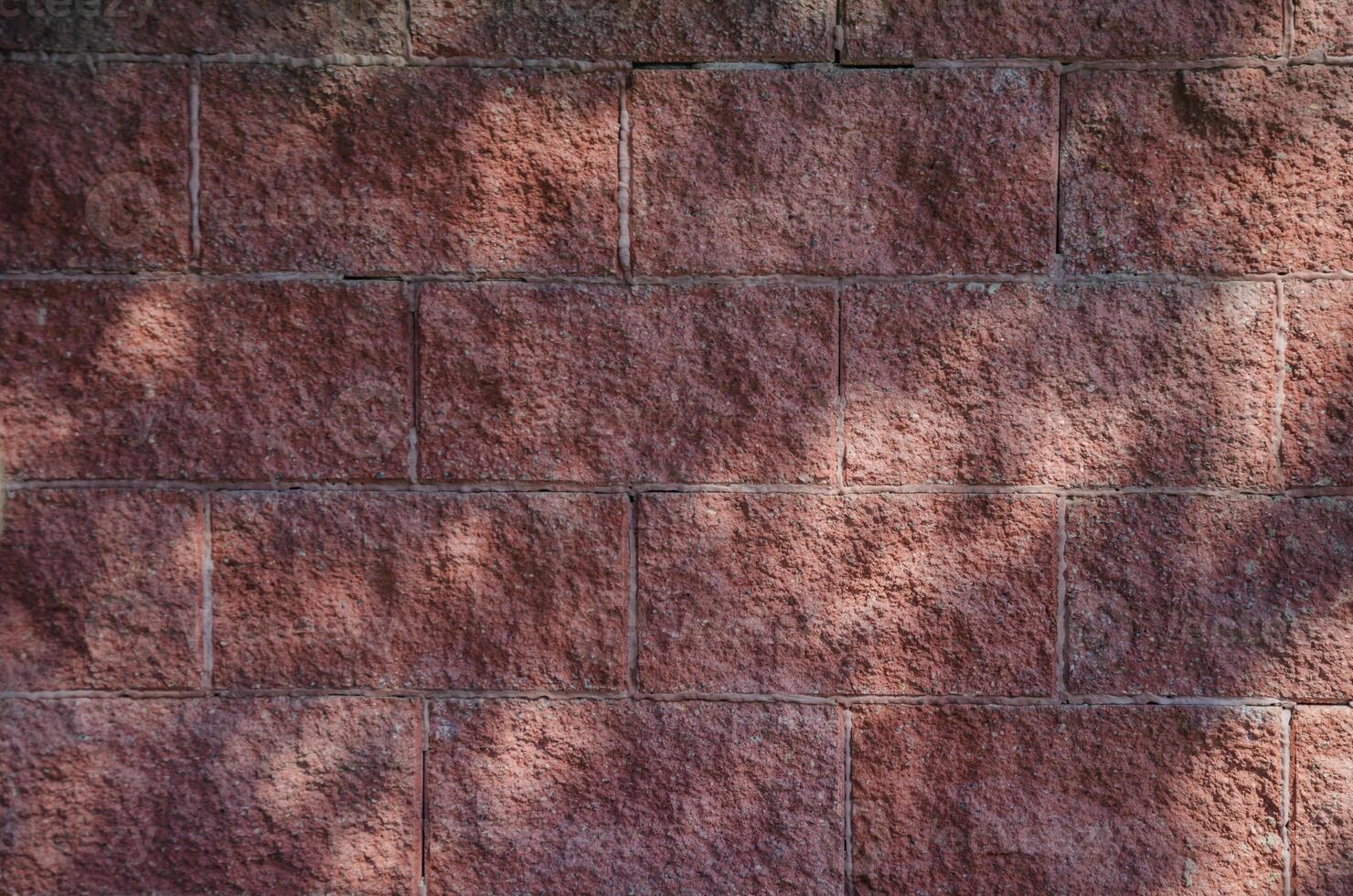 Red brick background with sun glare. High quality photo