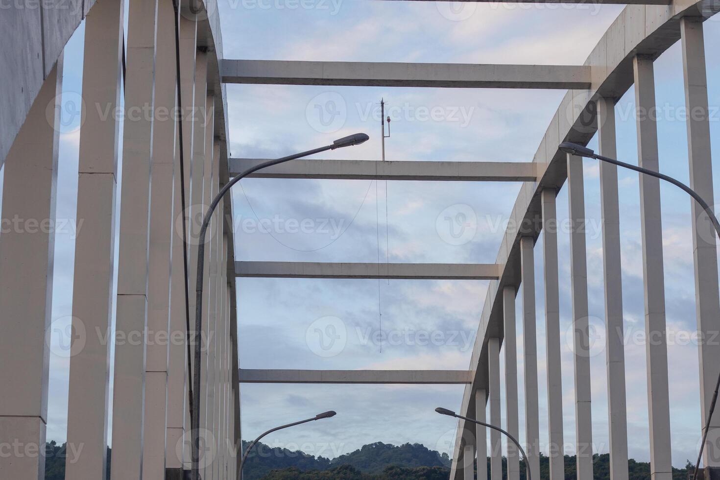 View of Architectural Bridge Structure with Streetlights photo