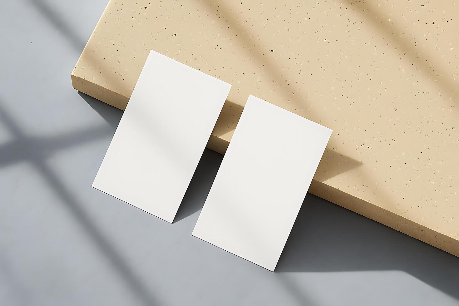 White Business Card Mockup on Concrete Surface photo