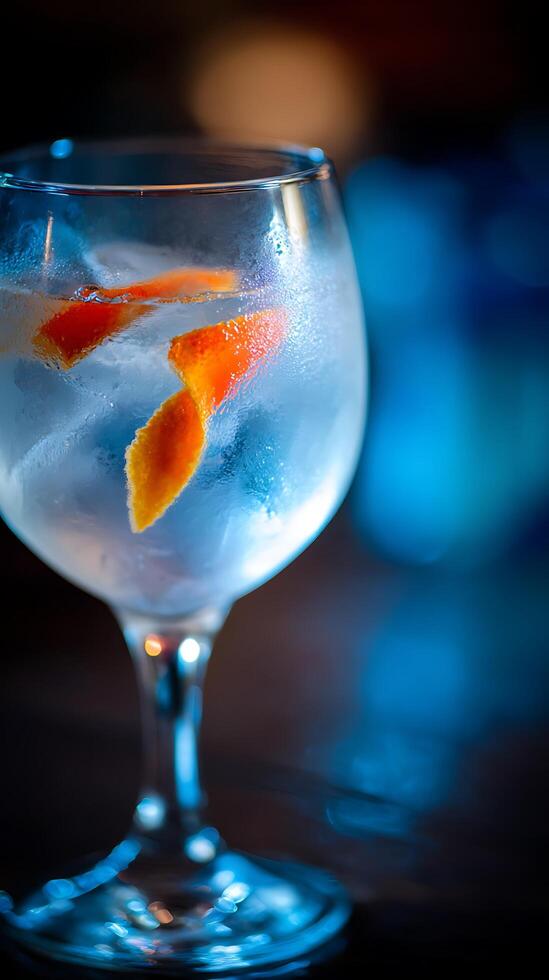 Refreshing Gin Cocktail with Orange Peel and Ice Close Up. photo