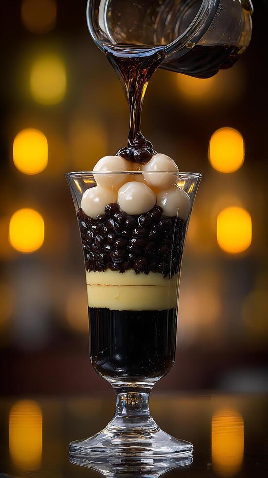 Sweet Dessert Pour A Layered Treat in a Glass with Bokeh Lights. photo