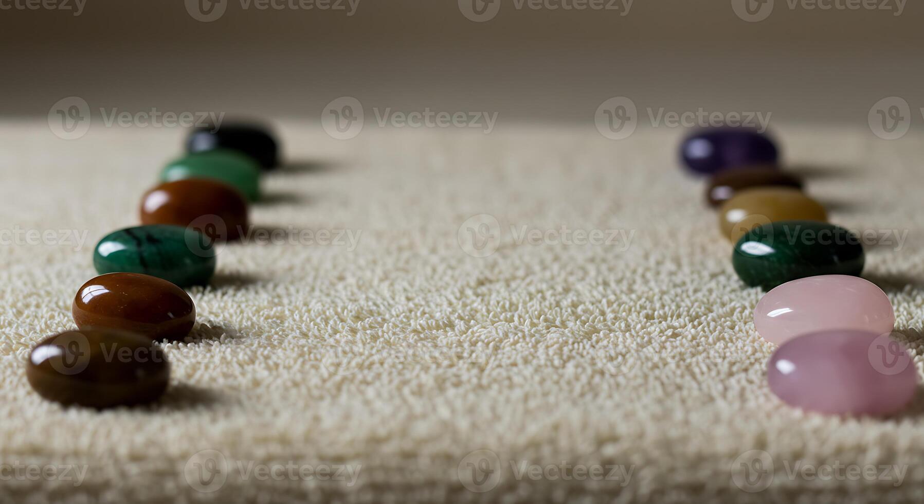 Colorful Smooth Stones Arranged in Line on Soft Beige Carpet photo