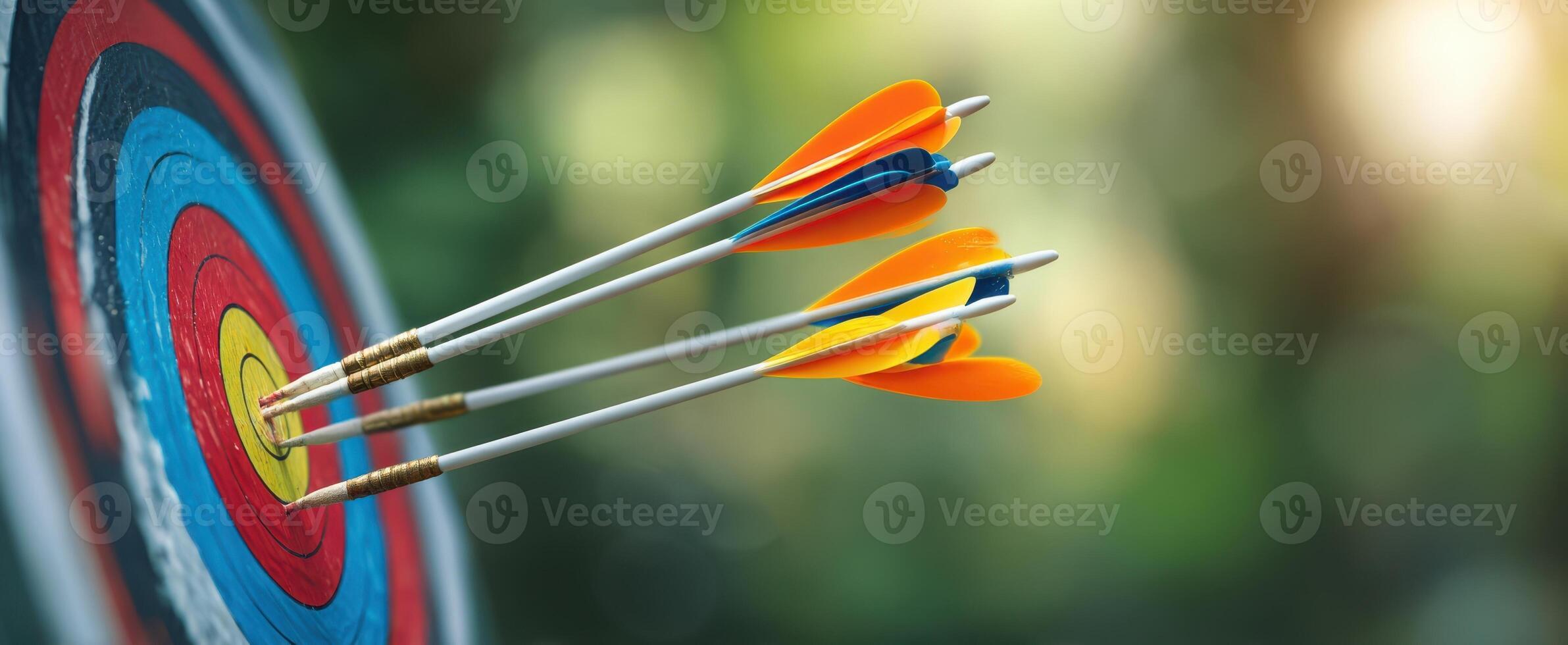 The colorful arrows striking the target in a vibrant archery scene. photo
