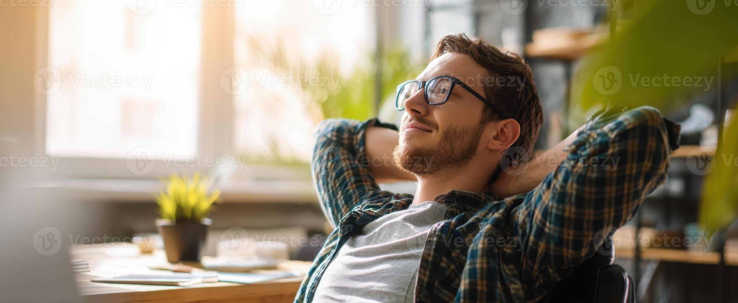 The relaxed man enjoying his time in a modern office space. photo
