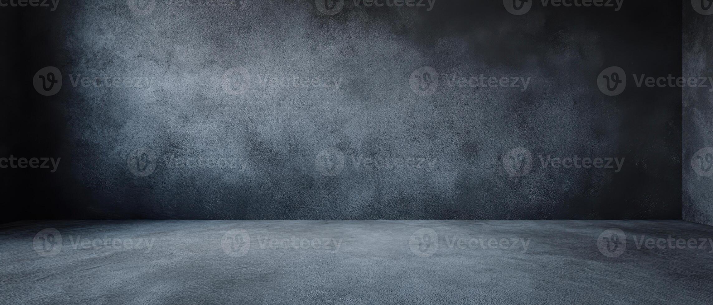 The dark textured walls and floor create an empty studio space. photo