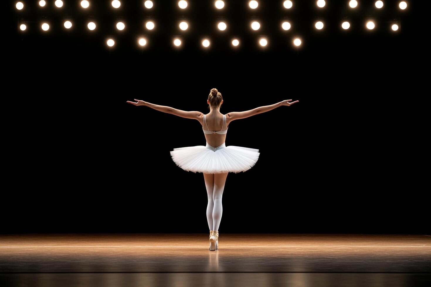 A ballerina in a tutu and white dress is standing in front of a spotlight photo