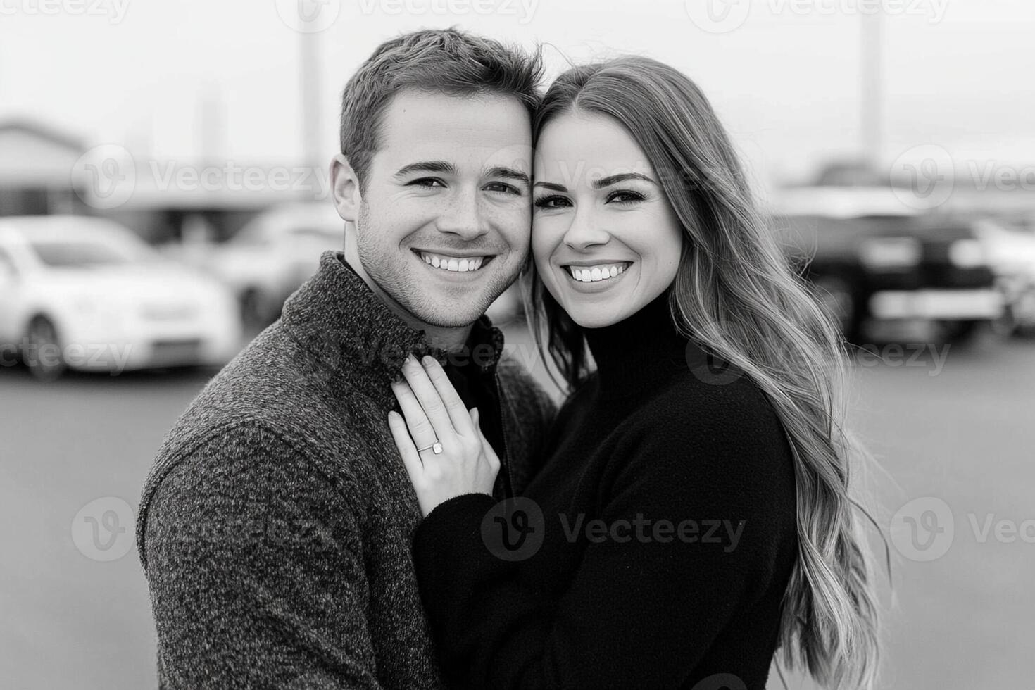 A couple is smiling in front of a car photo