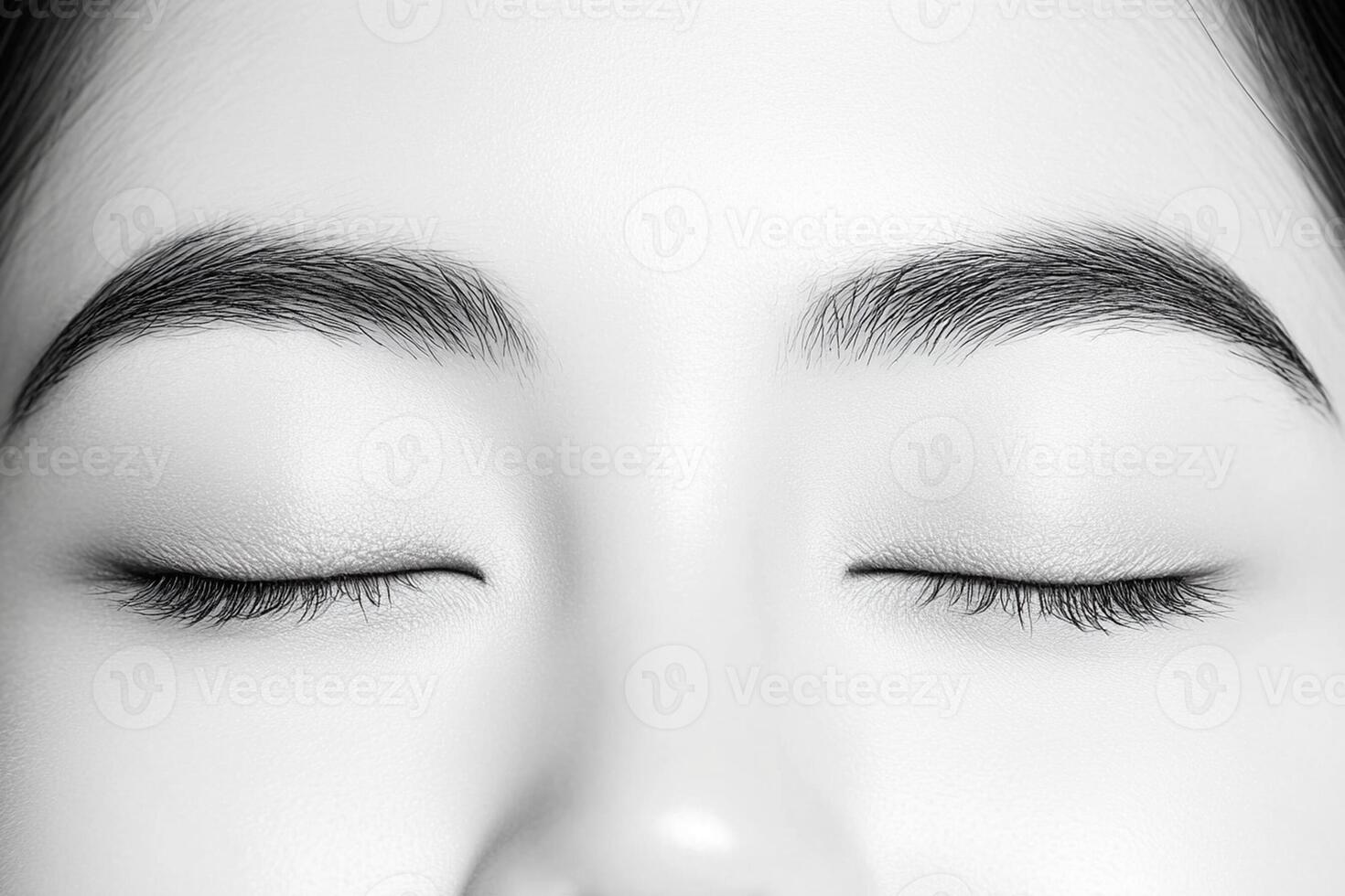 A woman's face with closed eyes and a closed mouth photo