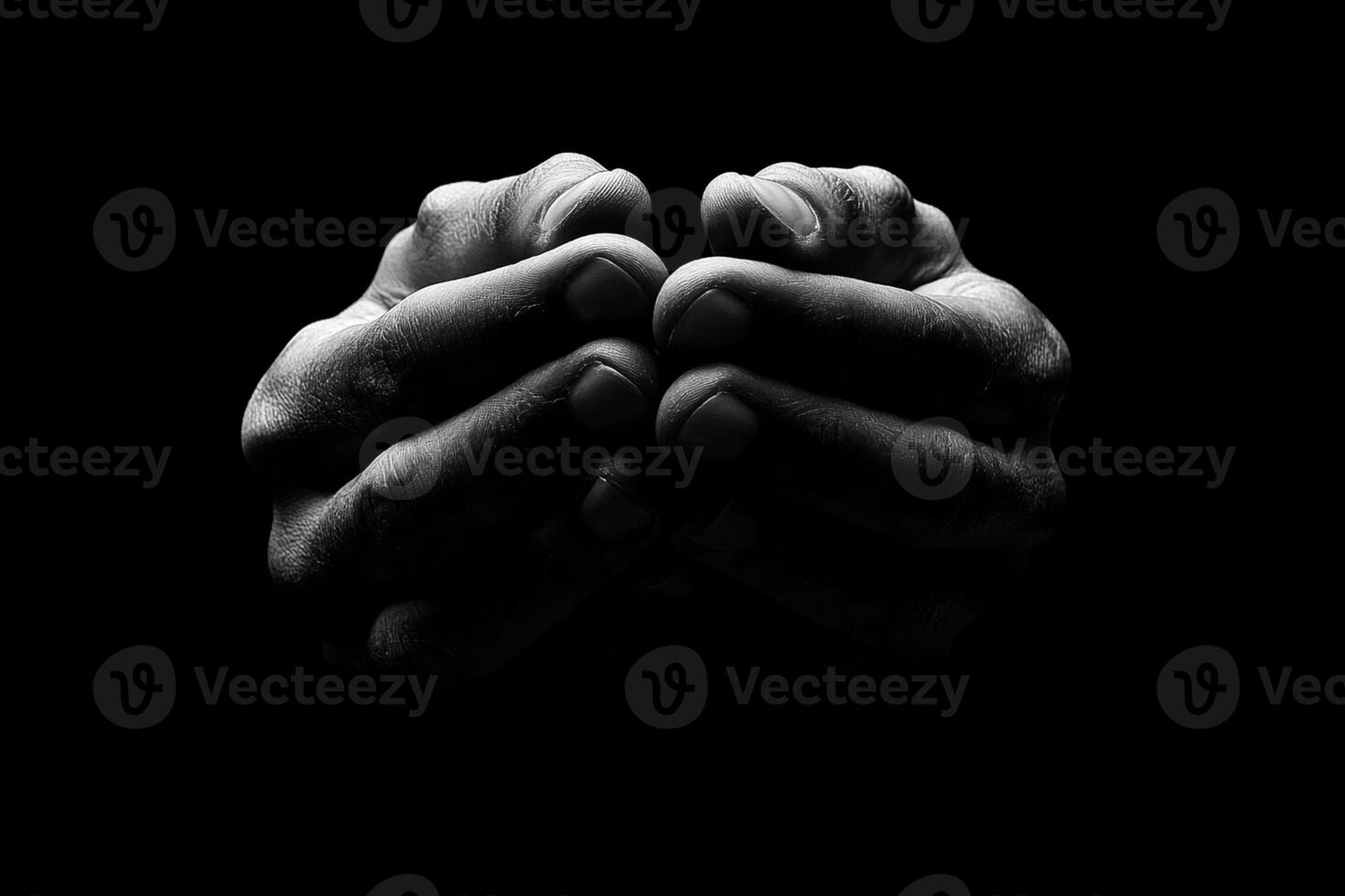 Hands praying in black and white photo