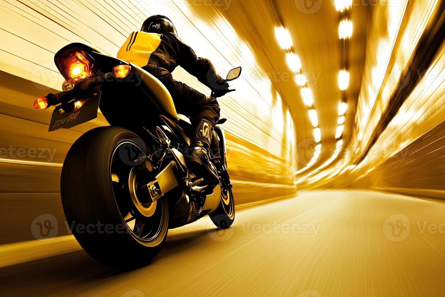 A person riding a motorcycle down a tunnel photo
