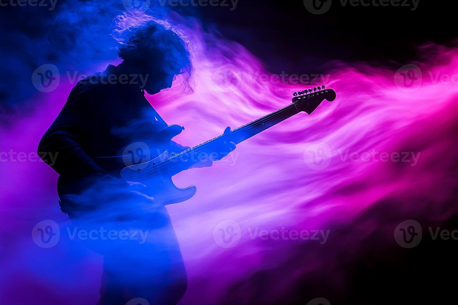A person playing an electric guitar in smoke photo
