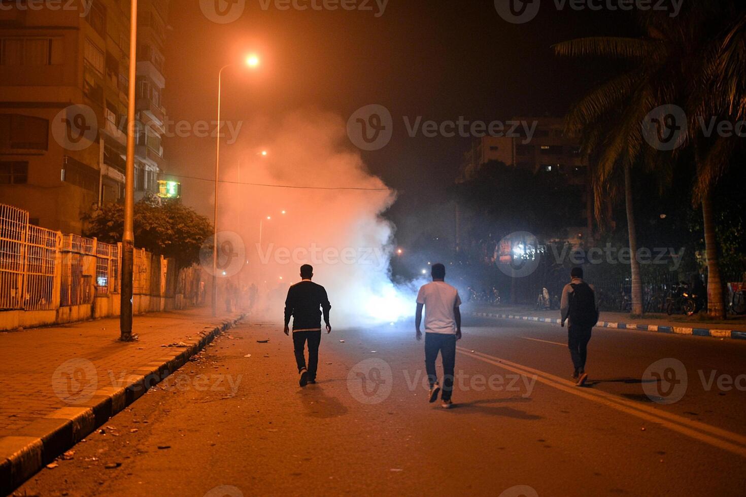 Protesters run away from tear gas fired by police during a demonstration in cairo, egypt photo