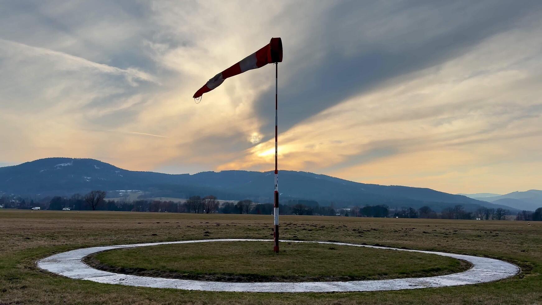 A Lonely Windsock at Twilight in a Beautiful Scenic Landscape of Nature and Exploration photo