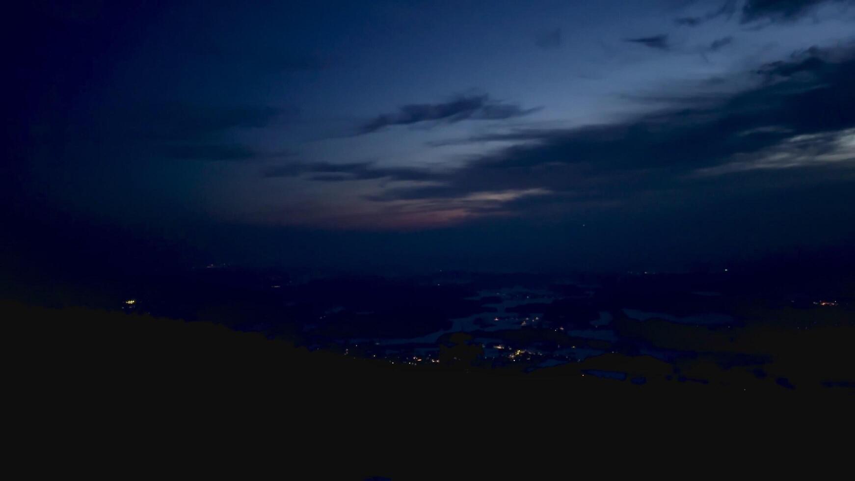 Illuminated night sky in the mountain forest photo