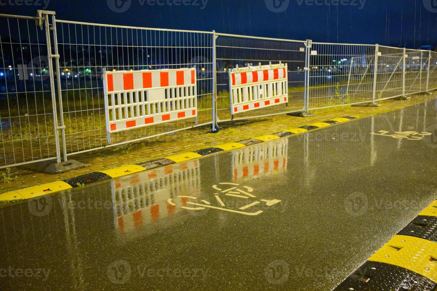 A bicycle path at Flensburgs harbor during heavy rain in Flensburg on the evening of July 22, 2025 photo