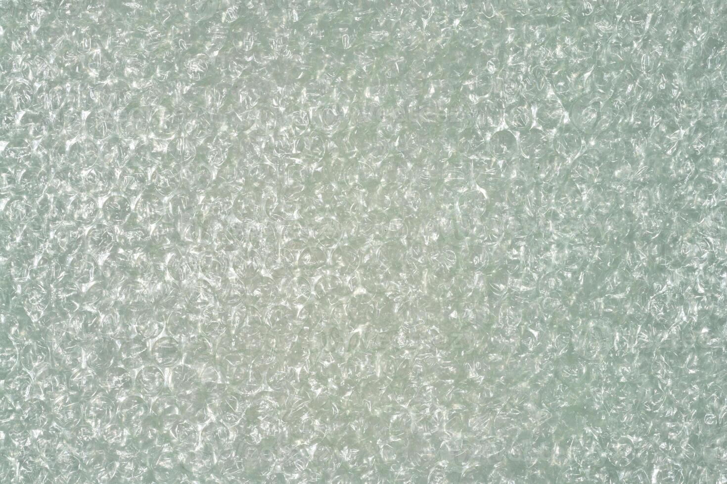Full frame close up of clear plastic bubble wrap, creating a textured background photo