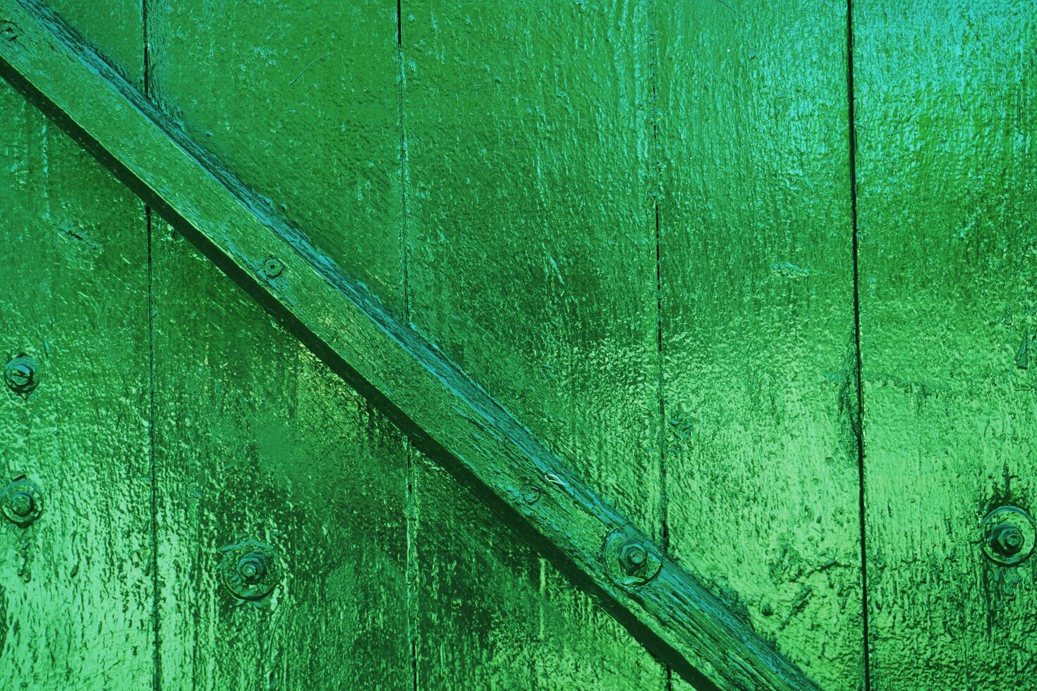 texture of wooden fence painted with golden green paint. photo