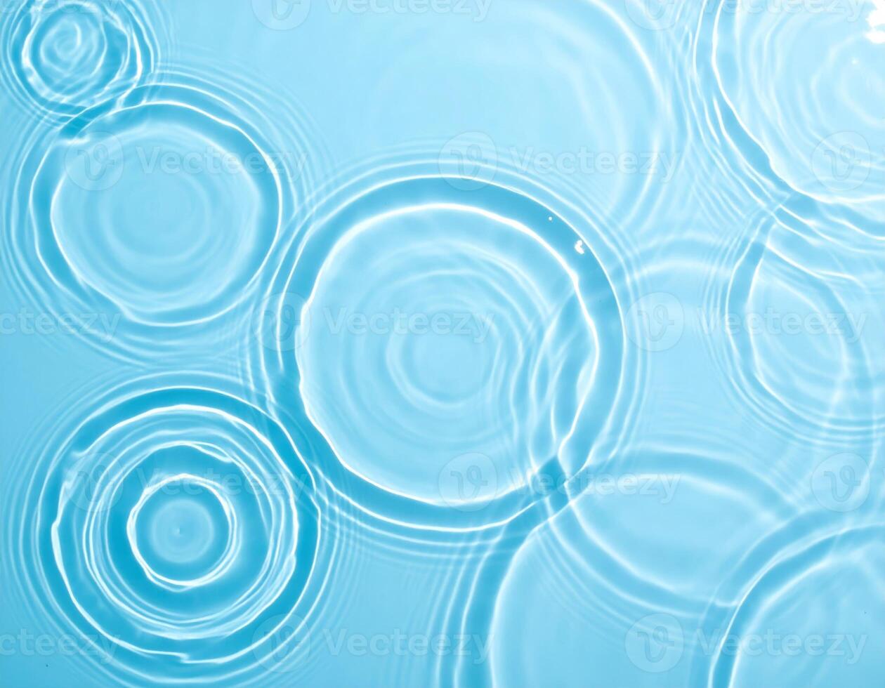 Sky-colored water with gentle ripples and flowing waves in the background photo