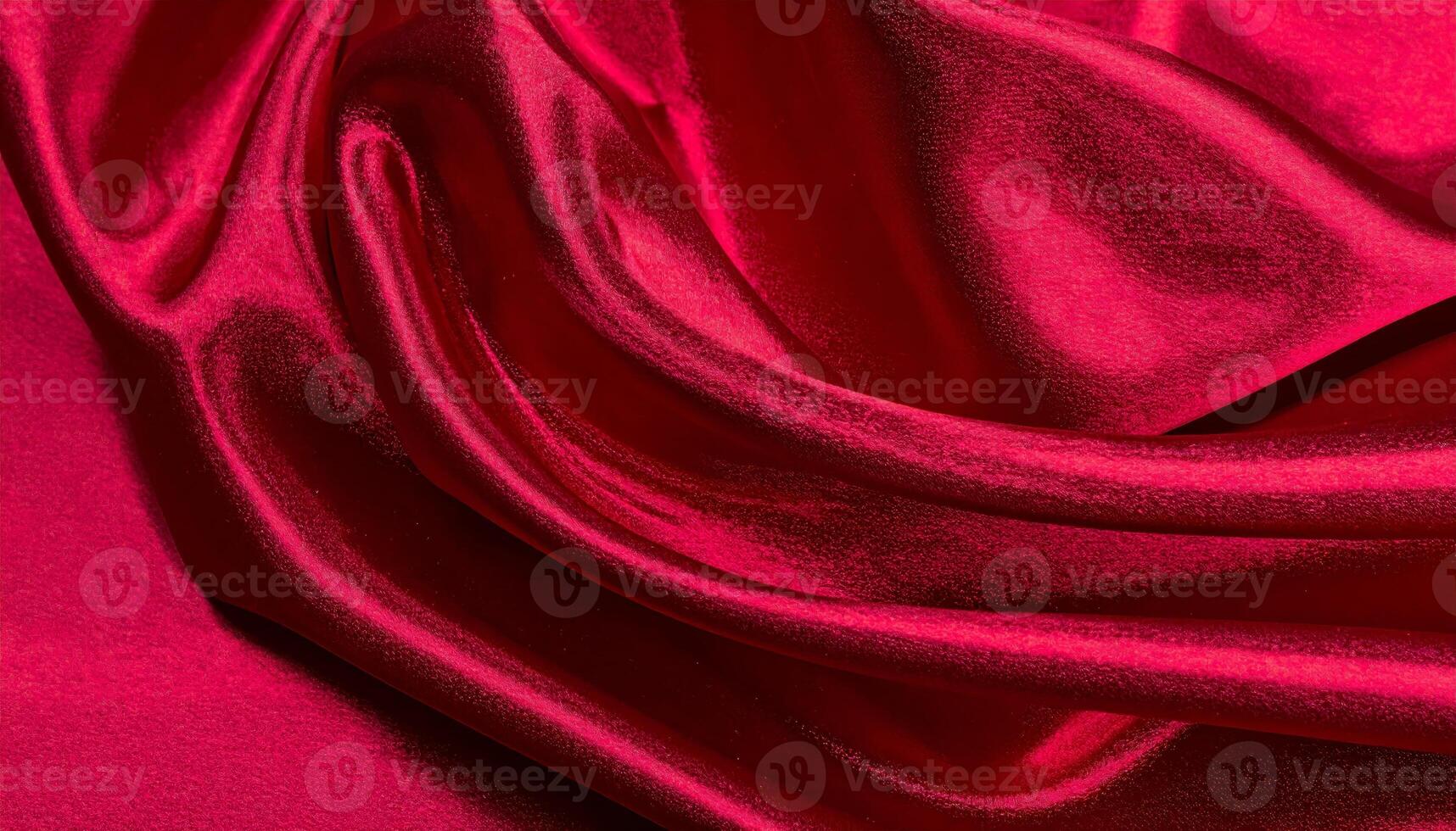 Close-up of a shiny, deep crimson silk fabric surface with a smooth texture photo