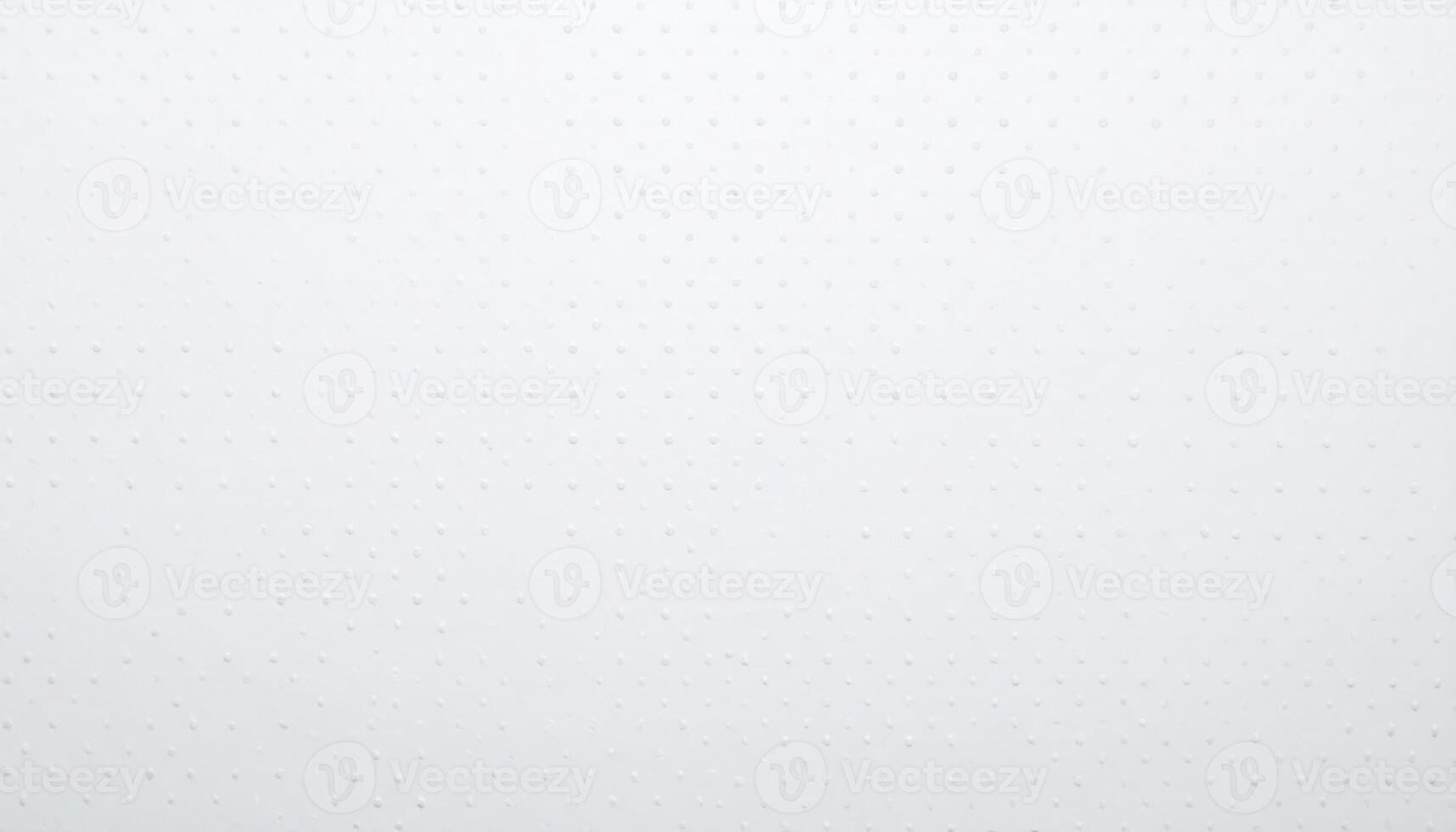 Close-up of a paper background featuring a white dotted pattern and textured surface photo