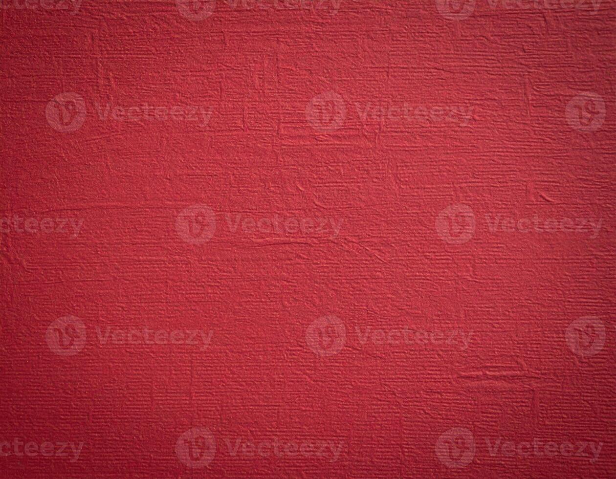Close-up of deep crimson paper with a textured background, ideal for presentation slides photo