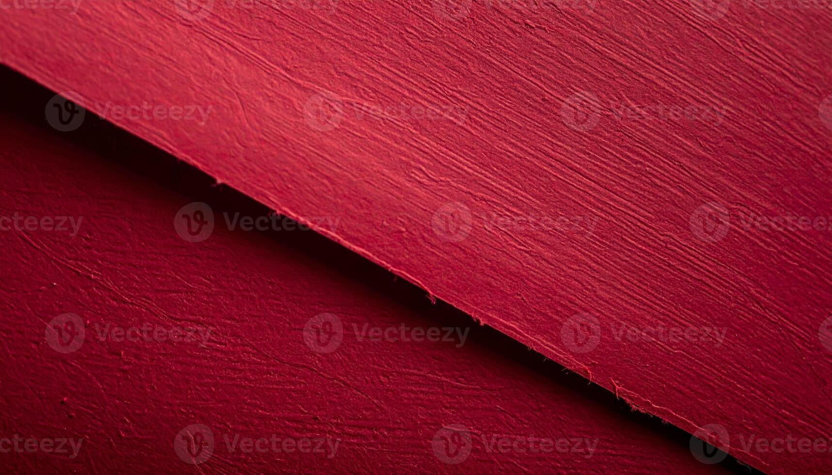Close-up of deep crimson paper surface with a textured background, suitable for presentation designs photo