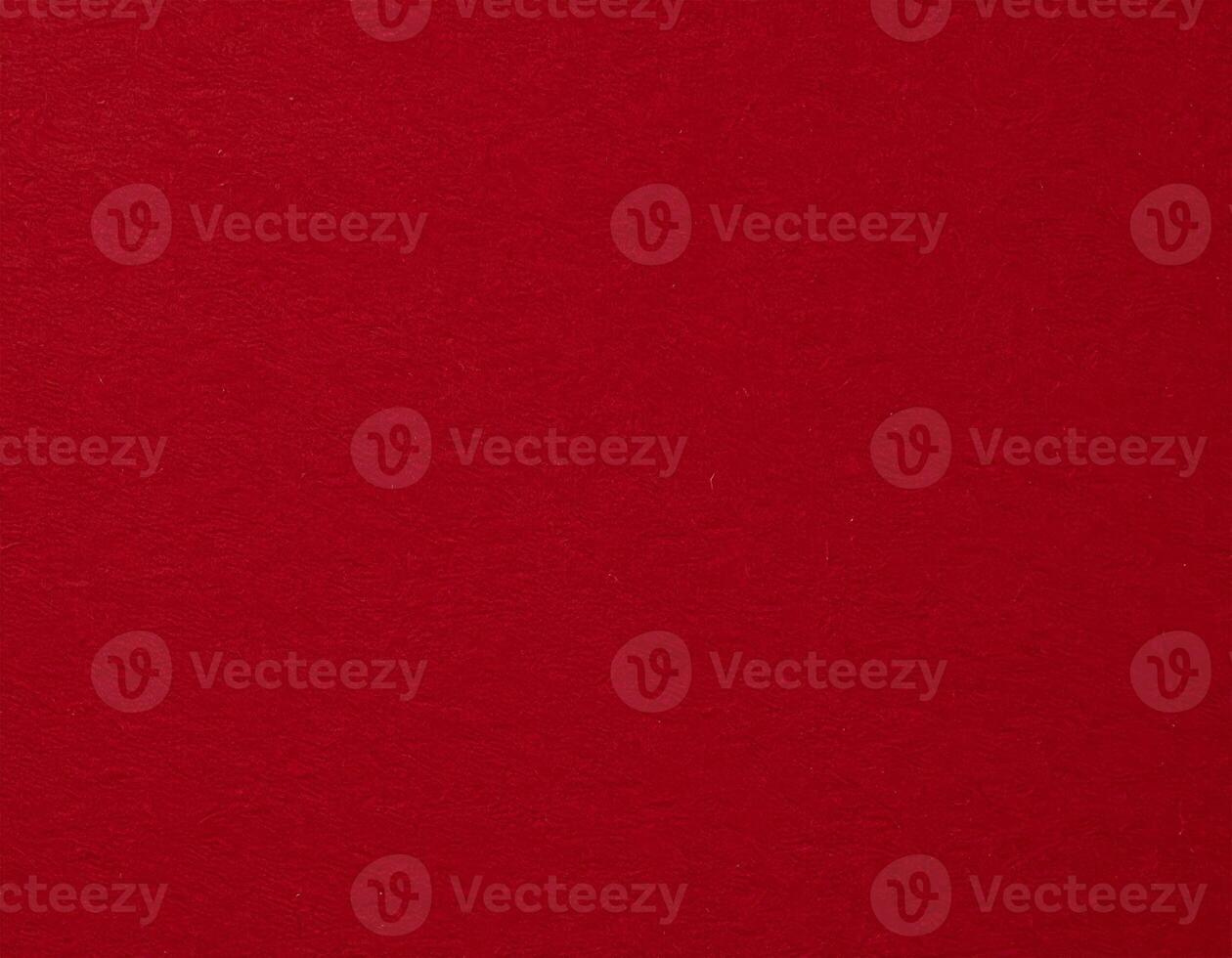 Close-up of deep crimson paper texture, ideal as a background for presentations featuring red patterns photo