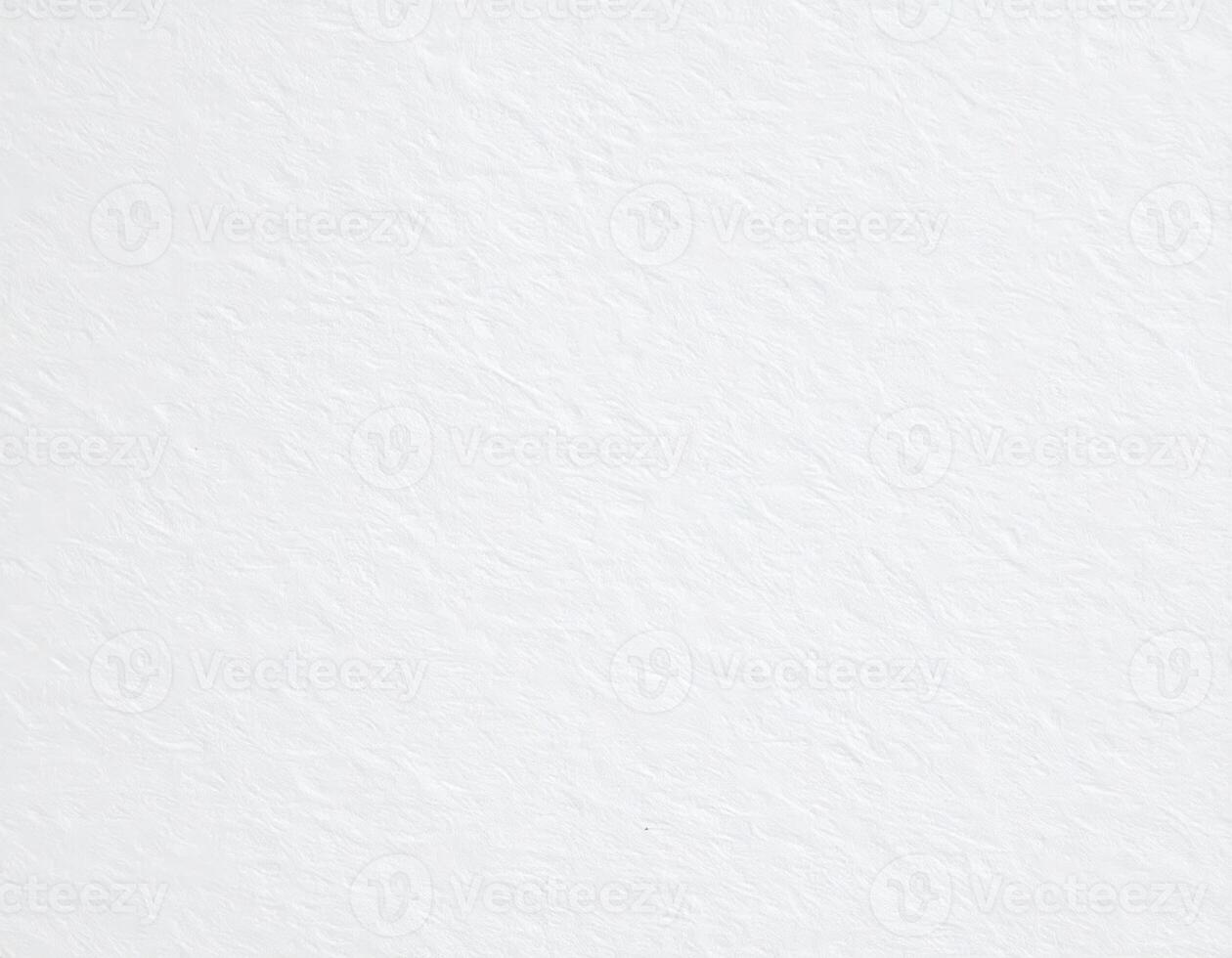 Close-up of a white, rugged paper surface with a textured pattern background photo