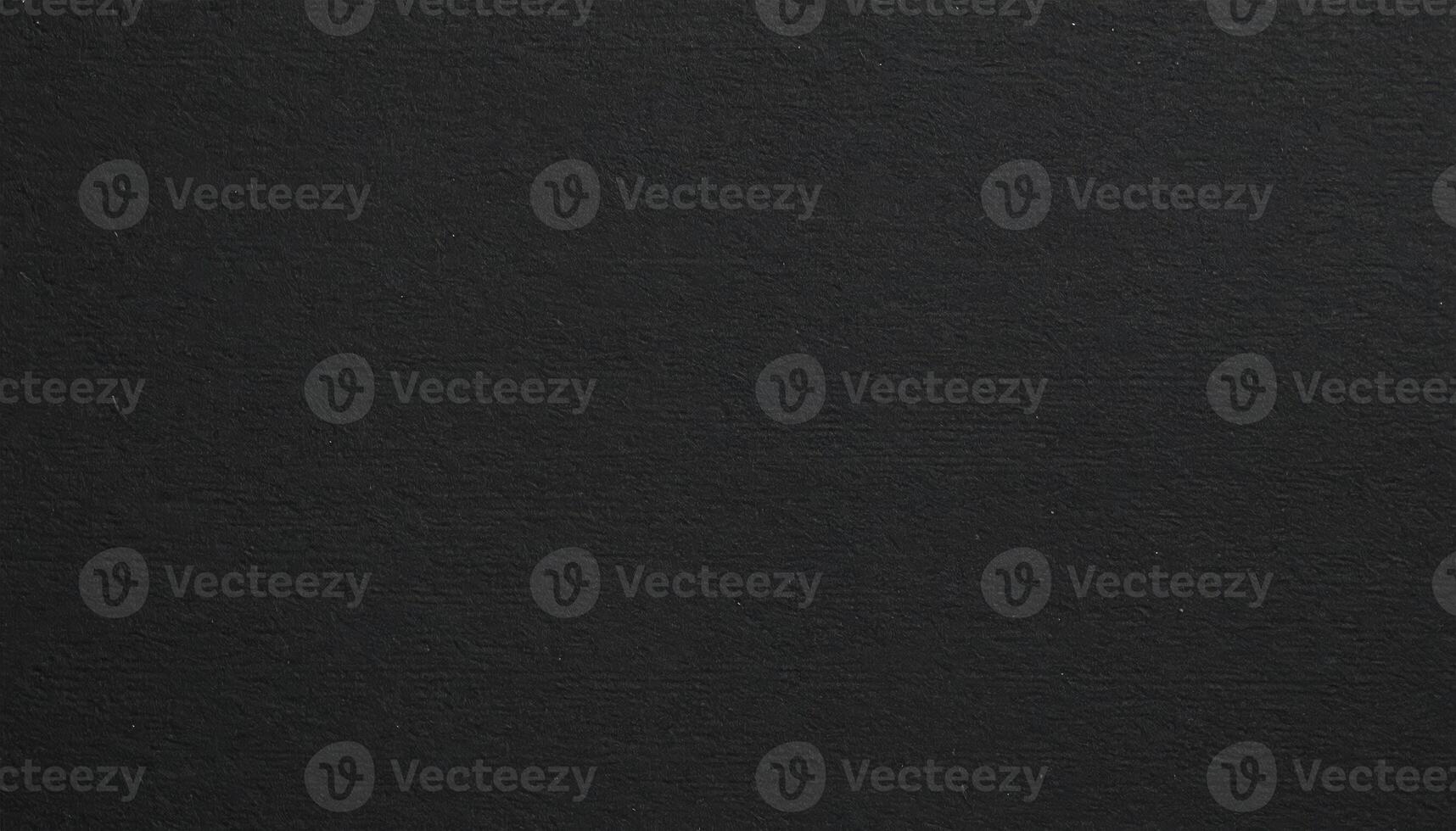 Near view of a dark, rugged paper surface with a textured pattern background photo