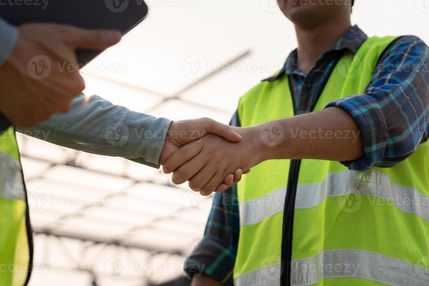 Construction team hands, shaking greeting start up plan new project contract in office center at construction site, industry ,architecture, partner, teamwork, agreement, property, contacts. photo