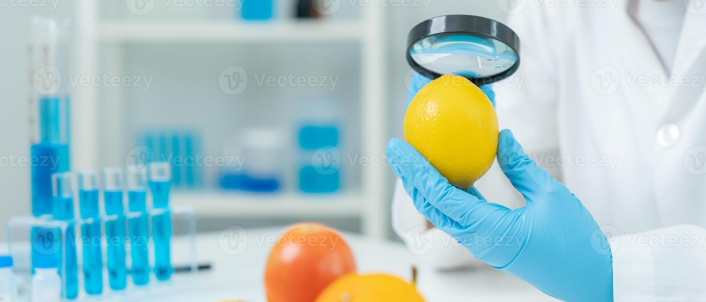Scientist use magnifying glass to check physical occur from chemical on fruit and vegetable residues in laboratory. inspect the concentration of chemical residues., find prohibited substances. photo