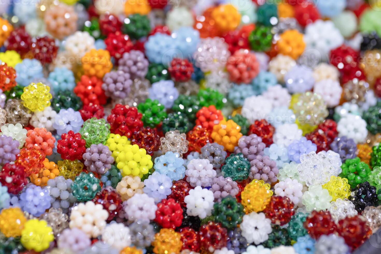 Colorful assortment of vibrant beads in various shapes and sizes creating a visually appealing texture photo