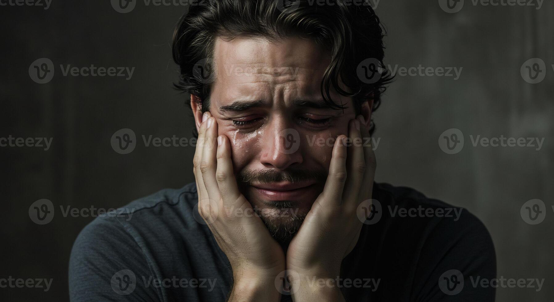 Close-up of a distraught man crying with tears, expressing deep sadness. photo