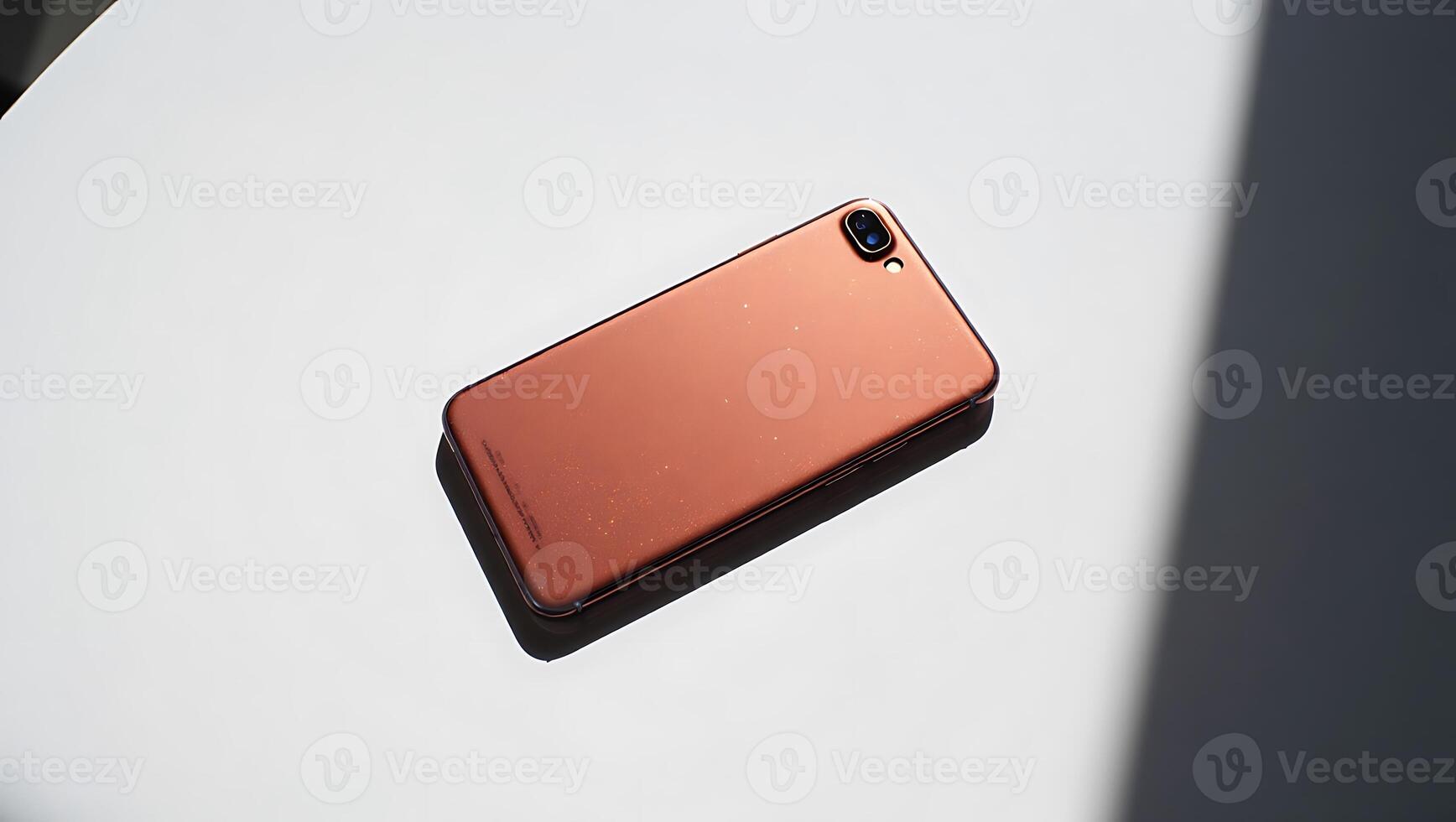Modern smartphone on a white surface in natural light displaying technology and communication capabilities with design features of innovative mobile devices photo
