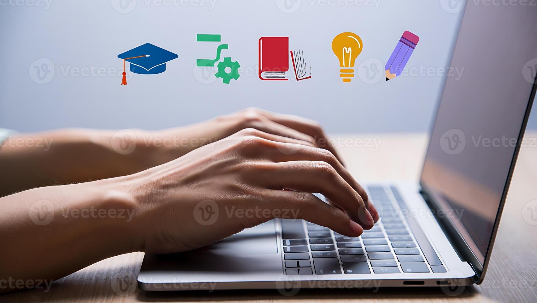 Online education and learning using a laptop with graduation cap automation idea book and writing tool for success in future technology concept photo