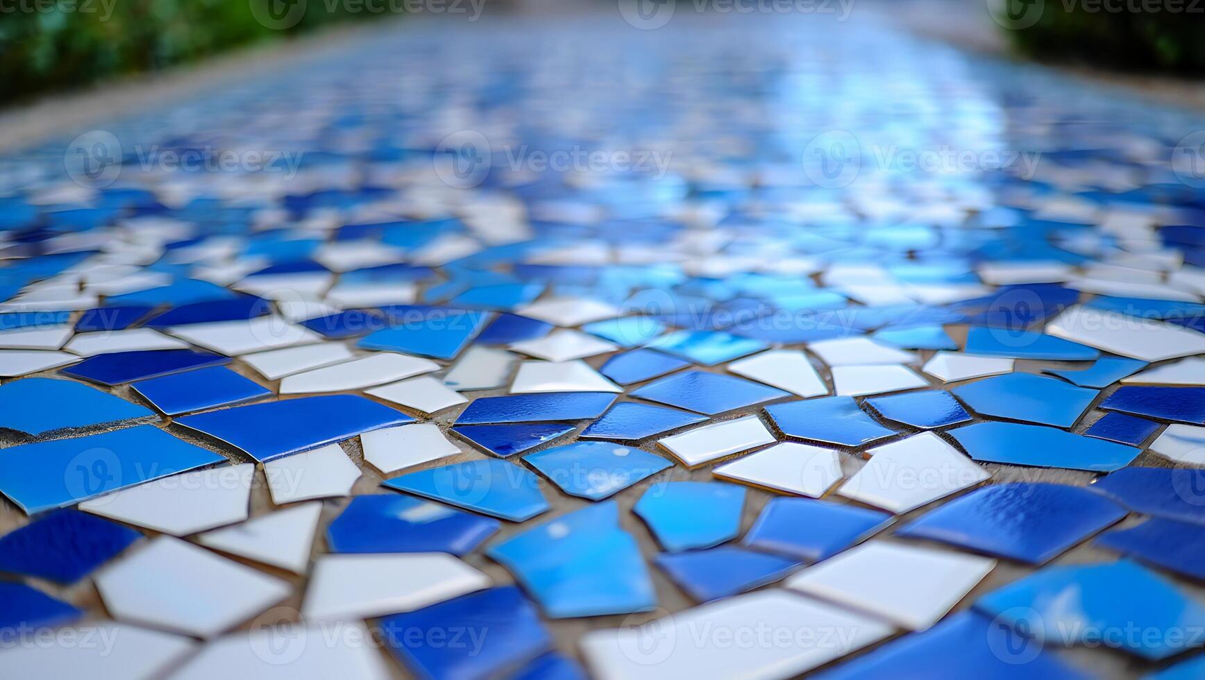 Artistic mosaic pattern floor design featuring blue and white tiles creating a unique texture ideal for architectural backgrounds and creative designs photo