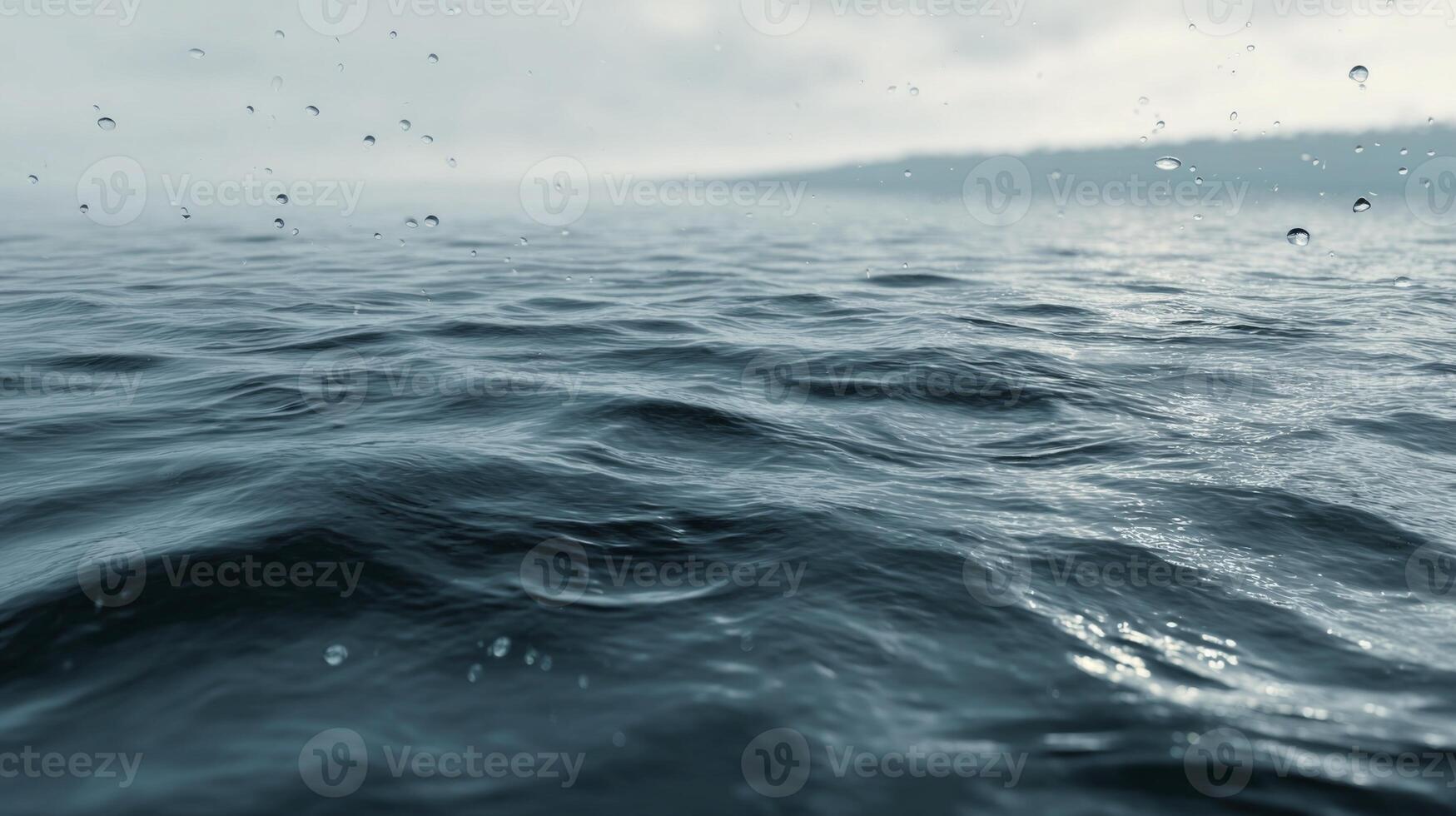 Serene Water Surface with Gentle Ripples and Raindrops Under Soft Cloudy Sky photo