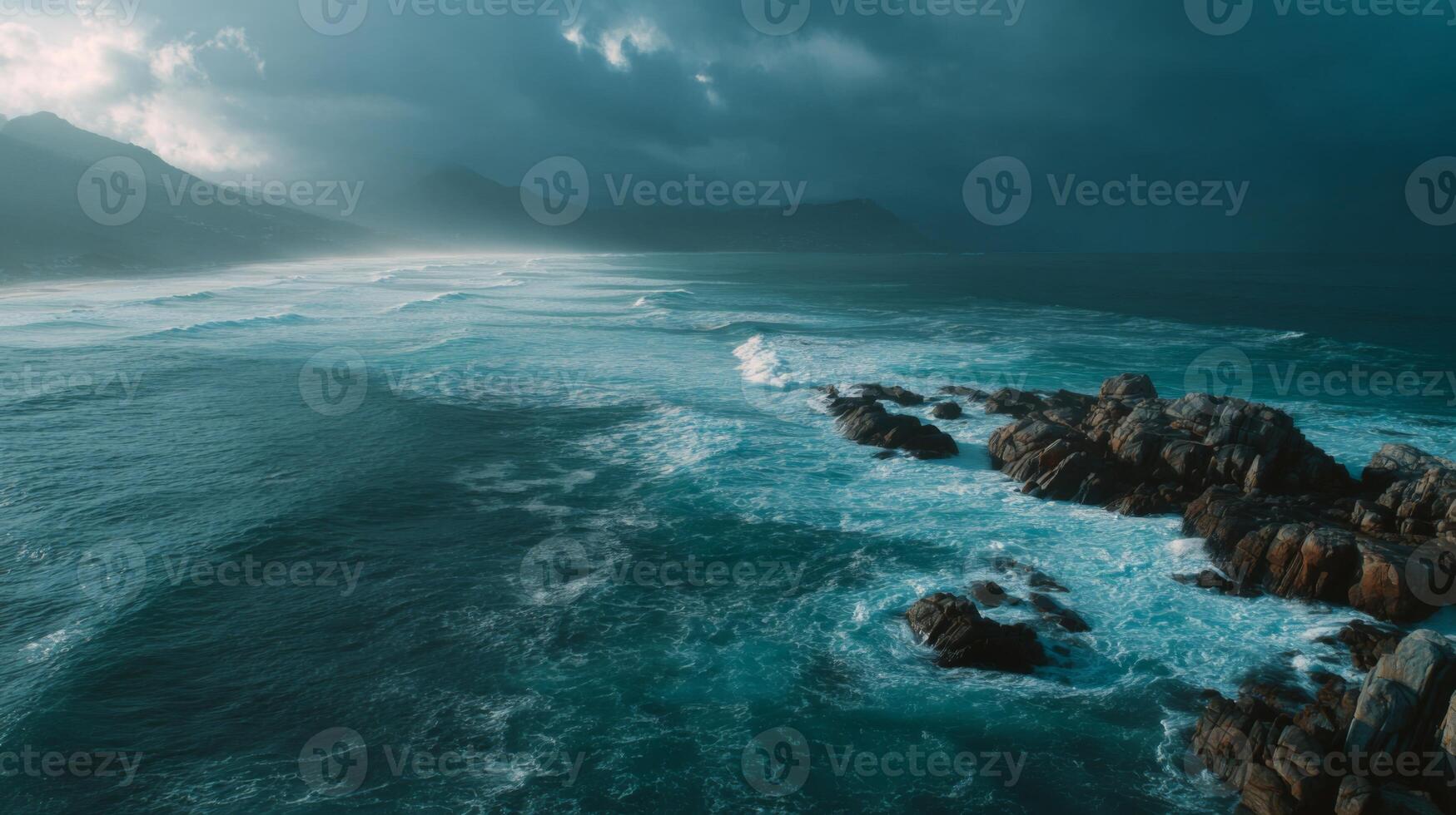 Dramatic Seascape at Dusk with Waves Crashing Against Rocky Shore Under Cloudy Sky in a Serene Coastal Landscape photo