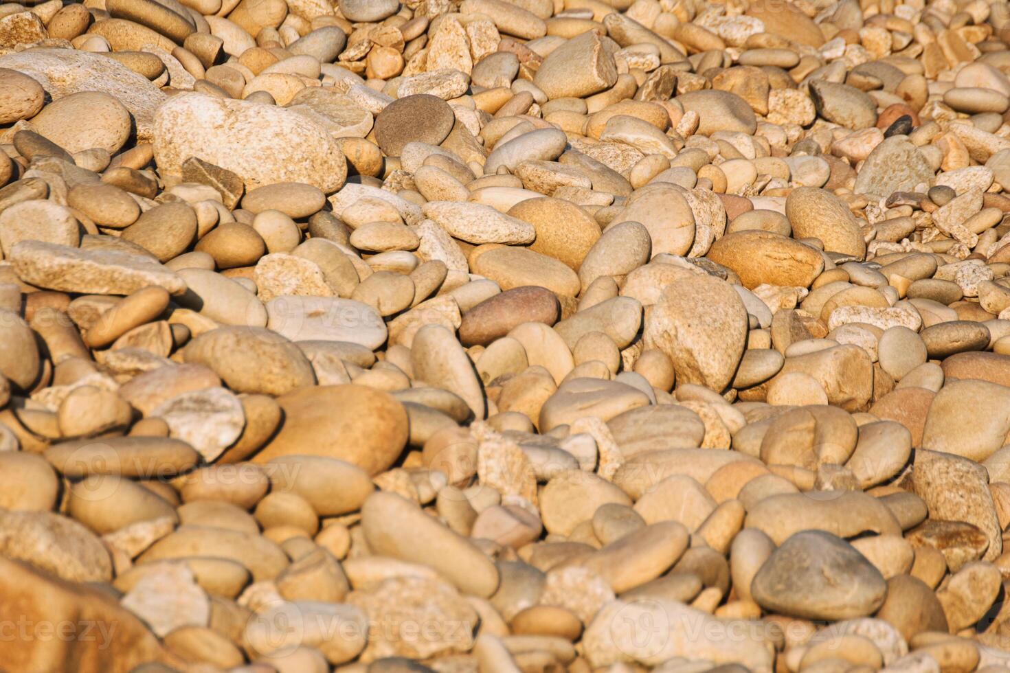 natural material texture an abundance of diverse sized smooth pebbles photo